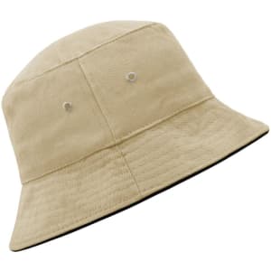 A beige bucket hat featuring ventilation eyelets and a contrasting black underside, with a logo present.