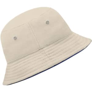 A beige bucket hat featuring a ribbed design and metal ventilation eyelets. The hat has a contrasting inner colour.