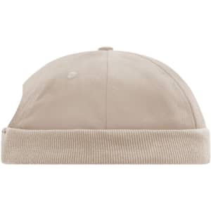 A beige 6-panel chef cap with a ribbed band and a rounded top, featuring a logo.