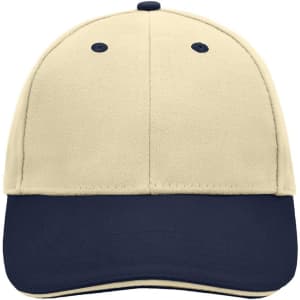 A 6 panel sandwich cap in cream with a navy blue peak and an embroidered logo.