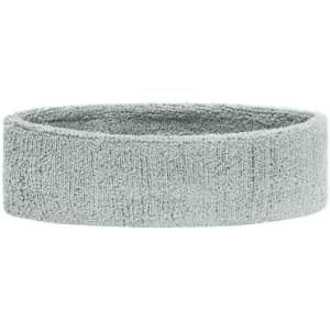 A grey terry headband with a soft, textured fabric. It features a simple design and has a logo on it.