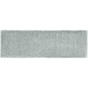 A soft grey Terry headband with a plush texture, featuring a branding logo.