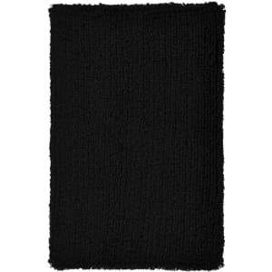 A fluffy black wristband with a textured surface, featuring a logo or branding.