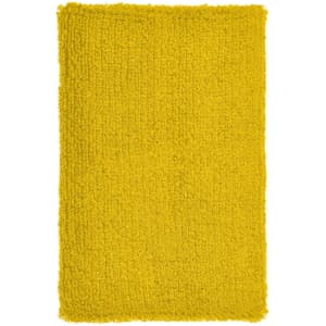 A fluffy yellow wristband with a textured surface and an attached logo.