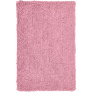 A pink sporty wristband made of soft, textured material, featuring a logo.