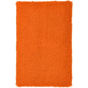 An orange textured wristband with a soft, fluffy surface, featuring a logo.