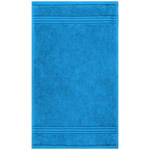 A blue guest towel featuring a textured design and horizontal striping. It also has a logo or branding.