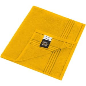 A yellow guest towel featuring a loop tag and striped design, with a logo displayed on the fabric.