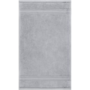 A grey hand towel with textured stripes, featuring a logo. Soft and absorbent, perfect for personal use.
