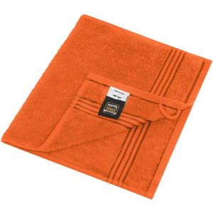 An orange hand towel featuring a textured surface and a folded corner with a brand label.