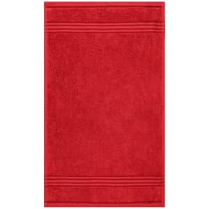 A red guest towel with a textured finish and decorative stripes along the edges. It features a logo.