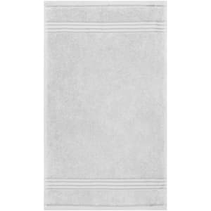 A grey guest towel with a textured design and two subtle stripes. It features a branding logo.