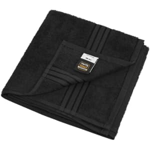 A black hand towel with a textured design and a small branded label. Fabric is plush and thick.