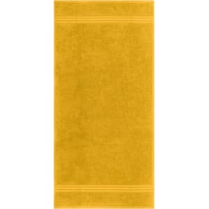 A yellow hand towel with a textured surface and decorative stripes. It features a logo.