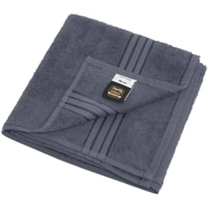 A hand towel in dark grey, folded neatly with a branded tag attached. It features two horizontal stripes.