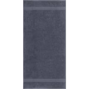 A hand towel in a dark grey shade, featuring two decorative stripes. It has a logo on the fabric.