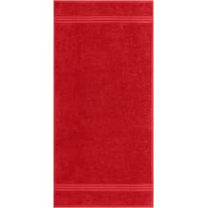 A red hand towel featuring two striped edges and a soft texture, with a branding logo present.