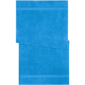 A blue bath towel featuring a textured design and a folded corner. Includes a branding logo.