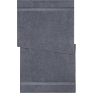 A grey bath towel featuring a textured design and subtle stripes. The towel has a logo on it.