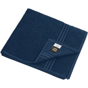 A navy bath towel featuring a folded corner with textured stripes and a small branding label.