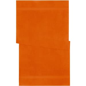An orange bath towel featuring two horizontal stripes on one side. It has a branded logo.
