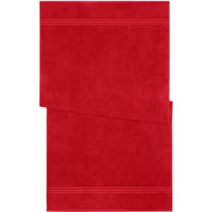 A red bath towel featuring a textured design and an embossed logo. Ideal for personal care and home use.