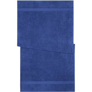 A blue bath towel with a textured design and two horizontal stripes. It features a logo.