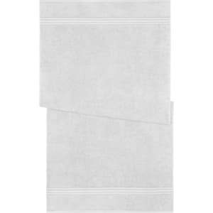 A bath towel in white, featuring a textured design with two horizontal stripes. It includes a brand logo.