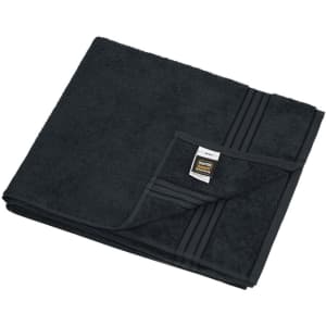 A black sauna sheet with a textured surface, neatly folded with a label in the corner.