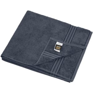 A dark grey sauna sheet folded neatly, featuring a textured surface and a small logo label on one corner.