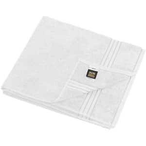 A white sauna sheet with a folded corner, featuring a small logo on the edge.