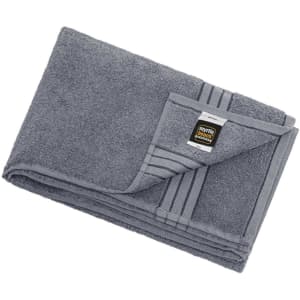 A grey bath sheet with a folded edge and a tag, featuring a logo. Soft and large for personal use.