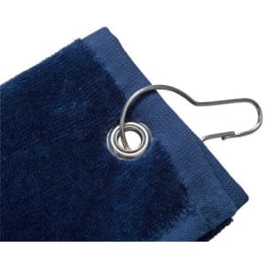 A navy blue golf towel with a grommet and clip for attachment. It features a soft texture.