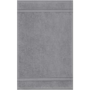A grey guest towel featuring a textured design with two horizontal stripes. The towel has a subtle branding logo.