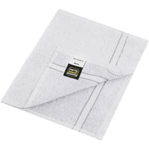 A white guest towel with a textured finish and a branding label in the corner.