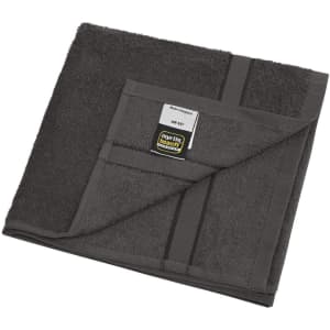A grey hand towel folded neatly, featuring a tag and a logo. The texture appears soft and absorbent.