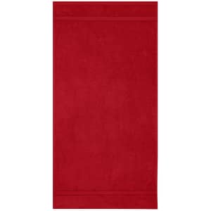A red hand towel with a textured finish and a subtle striped pattern at both ends. It features a logo.