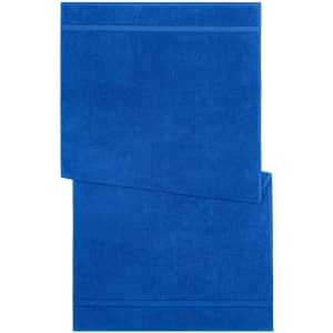 A blue bath towel featuring a textured pattern and a logo in the corner.