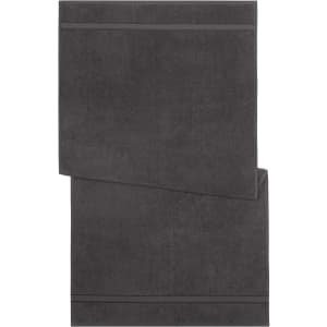A dark grey bath towel with a simple design and two decorative stripes at the ends. It features a logo.