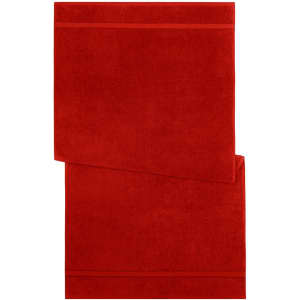 A red bath towel featuring a textured design, neatly folded with a branded logo in one corner.
