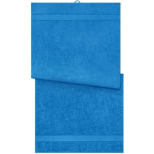 A blue bath towel with a textured finish, featuring a logo and an overlapping design.