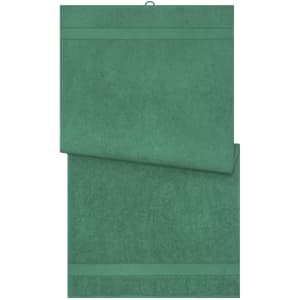 A green bath towel with a textured surface and a hanging loop. It has a simple design and includes a logo.