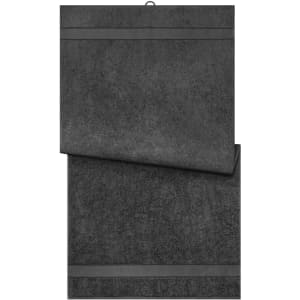 A dark grey bath towel displayed in a folded position, featuring subtle horizontal stripes. It has a brand logo on it.
