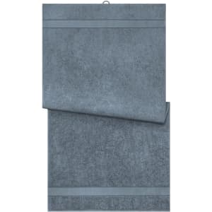 A set of grey bath towels stacked with a textured surface and contrasting stripes. The image includes a logo.