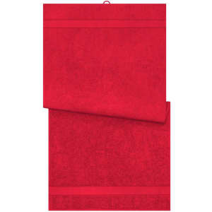 A red bath towel displayed flat, featuring a textured surface and a branding logo on one side.
