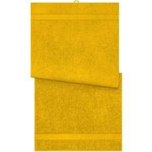 A set of yellow bath towels, with a textured fabric and a hanging loop. The towels feature a simple design.