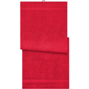A red sauna sheet displayed with a smooth texture, featuring a hanging loop and a simple design.