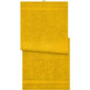 A yellow sauna sheet with a textured surface, featuring a hanging loop and a folded edge.