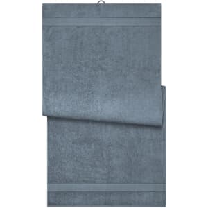 A soft, grey bath sheet folded neatly with two horizontal stripes. It features a simple design and a logo.