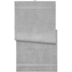 A grey bath sheet folded neatly, featuring a textured design and a hanging loop. It includes branding.